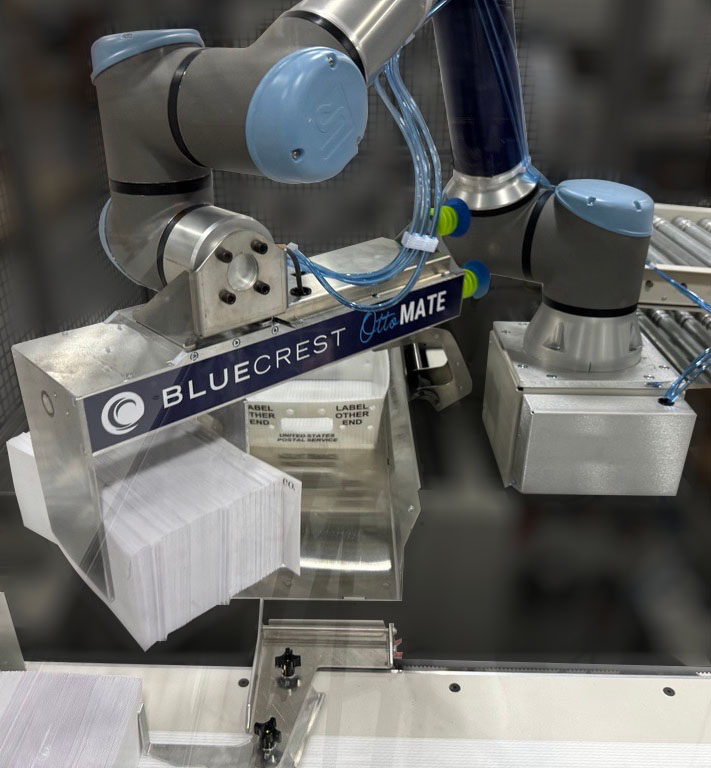 BlueCrest mail production cobot automatically puts envelopes into mail trays